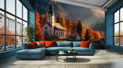 Morning light illuminating the Parish Church of St. Sebastian, with Ramsau Village's vibrant autumn colors Wall mural