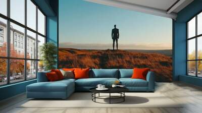 The Angel of the North statue standing tall against the backdrop of the English countryside. Wall mural