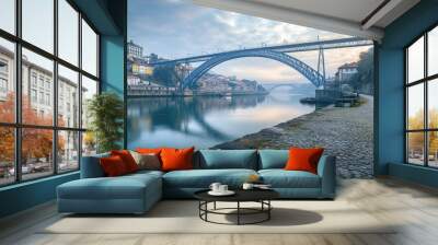 The iconic Ponte Dom Luis I Bridge spanning the Douro River in Porto, Portugal, captured from a scenic angle. Wall mural