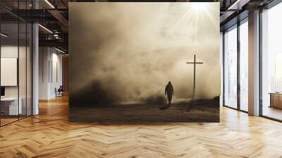 Silhouette of a man in the desert with a cross in the smoke and dust under light the sun, religion concept. 
 Wall mural