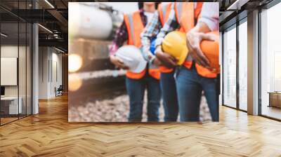 Team engineer holding helmet standing in row on site work, banner cover design. Wall mural