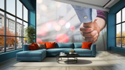 Two businessman shaking hands with business deals and congratulations on success, panorama image use for cover design. Wall mural