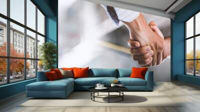 Two engineer shaking hands with deals and congratulations on success, panorama image use for cover design. Wall mural