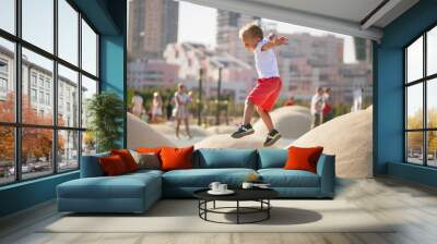 Boy jumping on trampoline Wall mural