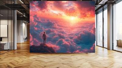 Person stands on a rocky cliff, overlooking a breathtaking sunset with vibrant clouds bathed in orange and pink hues Wall mural