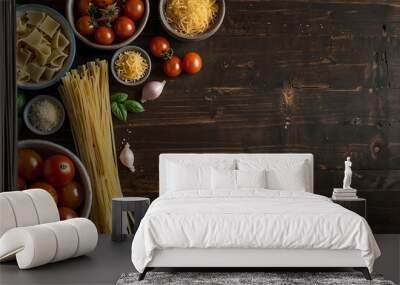 Flat lay of pasta with tomatoes and herbs on a wooden table Wall mural