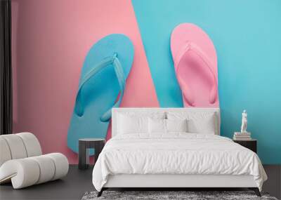 pink and blue sandals on pink and blue pastel background. Lover and Summer concept with copy space. Wall mural