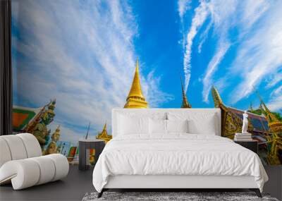 Emerald buddha temple golden pagoda blue sky with cloud sightseeing in Bangkok Wall mural