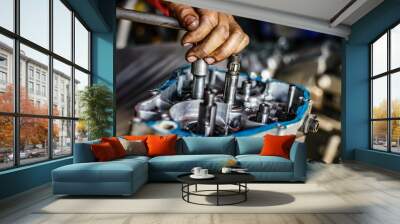 Maintenance and fix repair gear engine hand of technician close up Wall mural