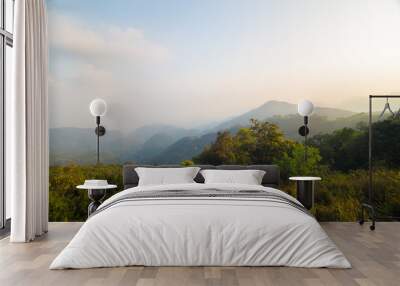 Mountain sunrise with fog aerial view Wall mural