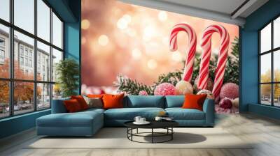 A festive scene with two red and white candy canes and a bunch of other candy Wall mural