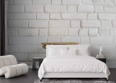 A polished brass bowl on a glossy white table against a minimalist white brick wall backdrop Wall mural