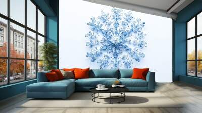 A snowflake made of blue glass is on a white background Wall mural