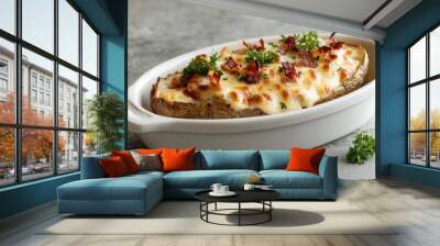 A white bowl with a baked potato and cheese on top Wall mural