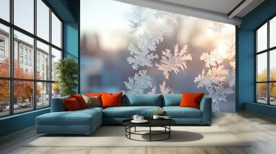 A window with frosted glass and snowflakes on it Wall mural