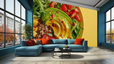 Avocado and quinoa bowl on a pastel yellow plate Wall mural