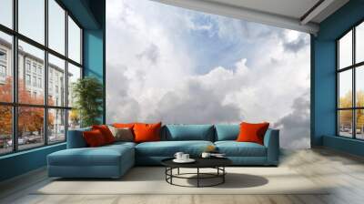 Blue sky and fluffy clouds. Beautiful cloudscape background. Sunlight on the clouds. Wall mural