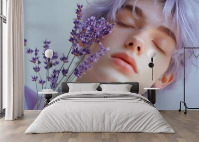 Closeup portrait of a man with lavender-colored hair, holding lavender flowers at his chest Wall mural