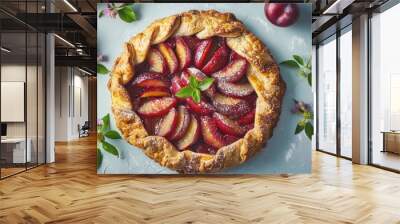 Plum galette on a pale blue backdrop Wall mural