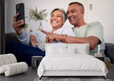 Love, phone or happy senior couple pointing at social media post, retirement news article or relationship blog story. Cellphone, home and elderly man, old woman or people reading online marriage info Wall mural