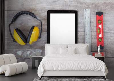 Top View of Digital Tablet and Assorted tools on wooden board, e Wall mural