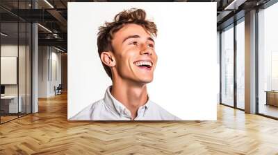 Portrait of handsome smiling young man looking up Wall mural