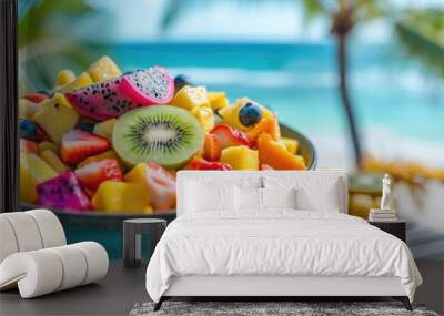 Tropical fruit bowl at sea beach Wall mural