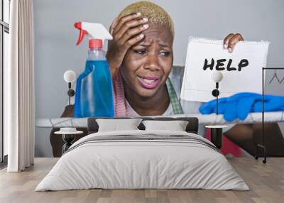 isolated young attractive and unhappy black afro American woman on kitchen iron board holding notepad with help text written feeling desperate Wall mural