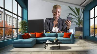 successful black afro American business woman working at modern office with mobile phone writing notes on notepad Wall mural