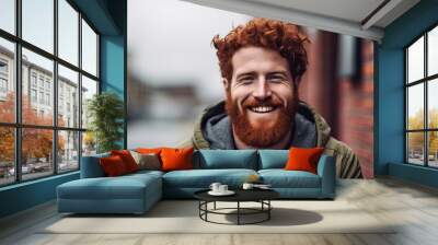 Bearded man in a cheerful mood wearing a green jacket flashes a smile Wall mural