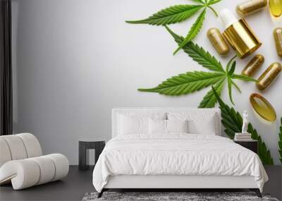 CBD capsules with cannabis leaves and hemp oil on white background Wall mural