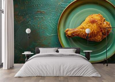 Chicken leg served on a green dish Wall mural