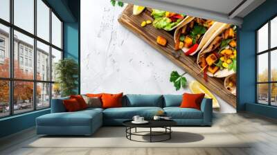 Chicken Tacos with Grilled Corn, Roasted Sweet Potatoes, Bell Pepper, and Parsley on a Wooden Board with a White Concrete Background, Elevated View, Blank Space Wall mural