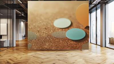 Close-up of two dialogue balloons, one circular and one rectangular, placed on a corkboard. Wall mural