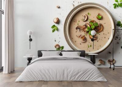 Creamy mushroom soup in a dish on white background top down view with empty space Wall mural