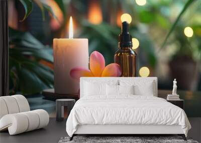 Essential oil bottle plumeria flower and candle on a flat tablet Wall mural