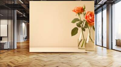 Floral arrangement with two glass vases three orange roses on beige backdrop Minimalistic design with space for text Wall mural