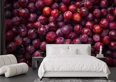 Freshly picked red grapes arranged in a pattern Close up with copy space top view Wall mural