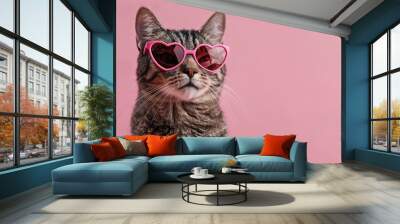 Funny cat wearing heart shaped sunglasses on pink background Postcard featuring cat with text space Ideal for Valentine s Day weddings women s day birthdays Wall mural