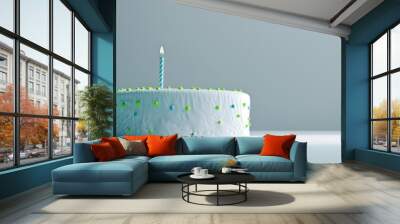 Large White Birthday Cake Featuring Green and Blue Details and Ten Candles Viewed from a Low Perspective Wall mural