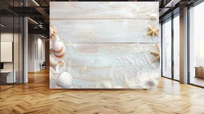 Summer themed flat lay with seashells and sand on light wood top view with copy space Wall mural