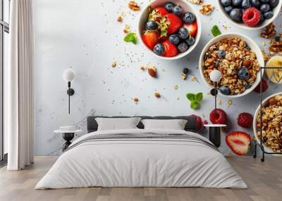 Top down view of vegetarian breakfast with granola and fruits on white background Wall mural