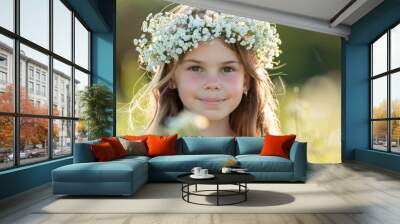 Young girl adorned with a white flower crown at a ceremony Wall mural