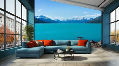 Distant mountains and blue water Wall mural