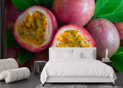 Fresh passion fruit on wood table in top view flat lay for background or wallpaper. Ripe passion fruit so delicious sweet and sour. Close up on a half of passion fruit in macro concept.Tropical fruit. Wall mural