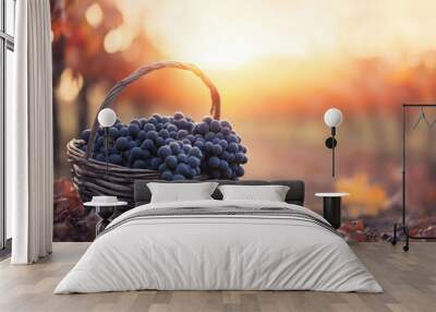 A basket filled with grapes in a vineyard at sunset, capturing the warmth of harvest season. Copy space  Wall mural