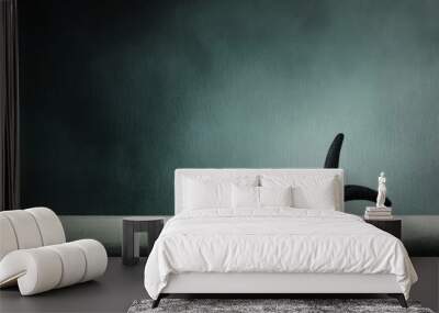 A minimalist black starfish on a clean surface with a dark misty background. Simple yet captivating. Wall mural