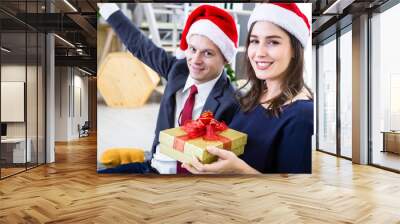 Happy new year 2020 concept,Happy couple holding exchanging gifts and Give a present in Christmas and New Year's Eve party Christmas tree background After finishing business work Wall mural