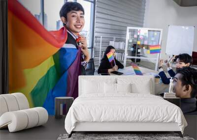 Homosexual Asian businessman with LGBT flag and Successful happy workers with in company  workers Group of asian business people and support in the meeting room at office Wall mural