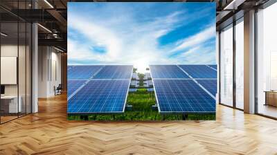 Photovoltaic solar power panel on dramatic sunset blue sky background, green clean Alternative power energy concept. Wall mural